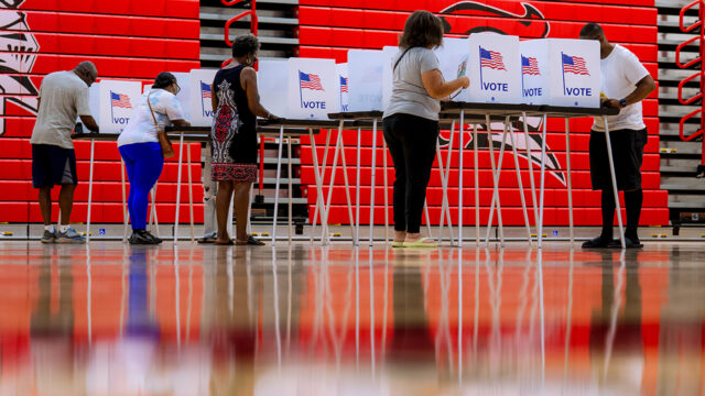 People vote in the primary election at Oak Park High School in Oak Park, Mich., Tuesday, Aug. 4, 2026, (AP Photo/Nic Antaya)