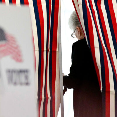 Camille Coulborn of Chesterfield, N.H., fills out her ballot inside a voting booth in Chesterfield during the New Hampshire State Primaries on Tuesday, Sept. 8, 2026. (Kristopher Radder/The Brattleboro Reformer via AP)