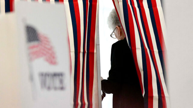 Camille Coulborn of Chesterfield, N.H., fills out her ballot inside a voting booth in Chesterfield during the New Hampshire State Primaries on Tuesday, Sept. 8, 2026. (Kristopher Radder/The Brattleboro Reformer via AP)